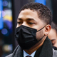 Jussie Smollett arrives with family members at the Leighton Criminal Court Building for his trial on disorderly conduct charges on December 6 2021 in Chicago, Illinois.
